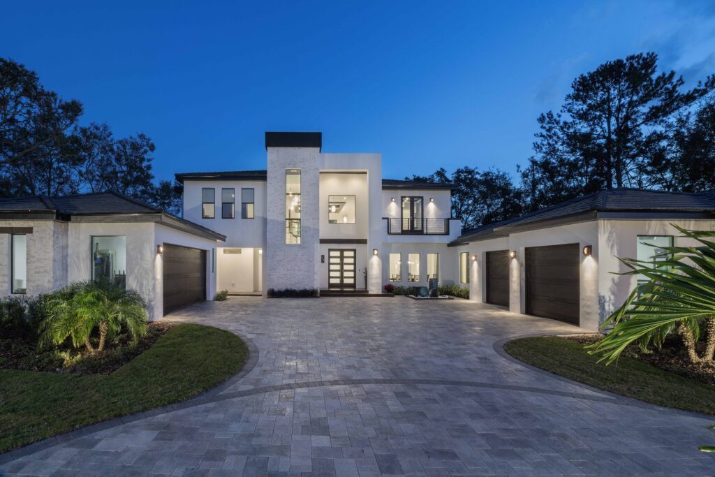 The Design Tourist's personal residence, a Florida Modern Home. The exterior elevation has a linear roofline with a subtle pitch to facilitate drainage of the region's ample rainfall. The home was designed by Orlando Custom Home Builder Jorge Ulibarri at www.ImYourBuilder.com 