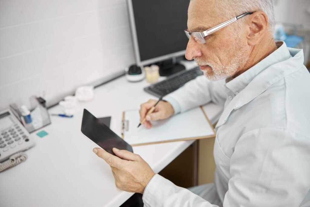 Busy senior citizen working in a medical clinic