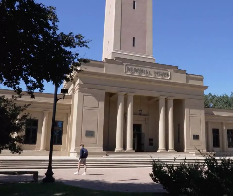a man standing in front of a LSU Military Museum