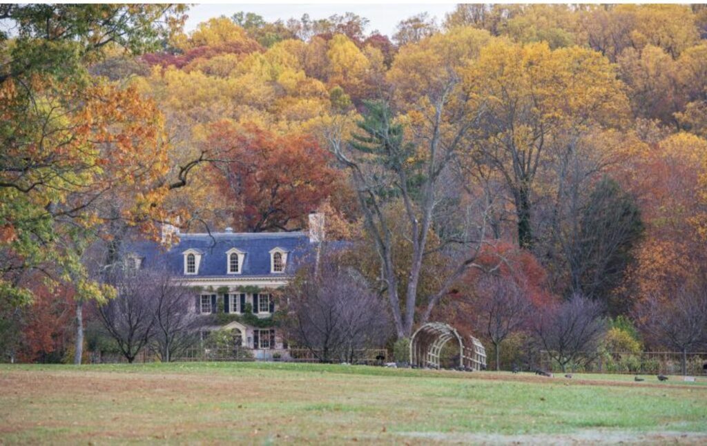 Eleutherian Mills estate at Hagley Museum surrounded by vibrant fall foliage in Wilmington, Delaware
