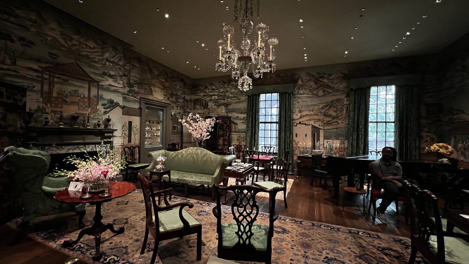 Elegant Chinese Parlor at Winterthur featuring green sofas, antique furniture, and hand-painted Chinoiserie wallpaper