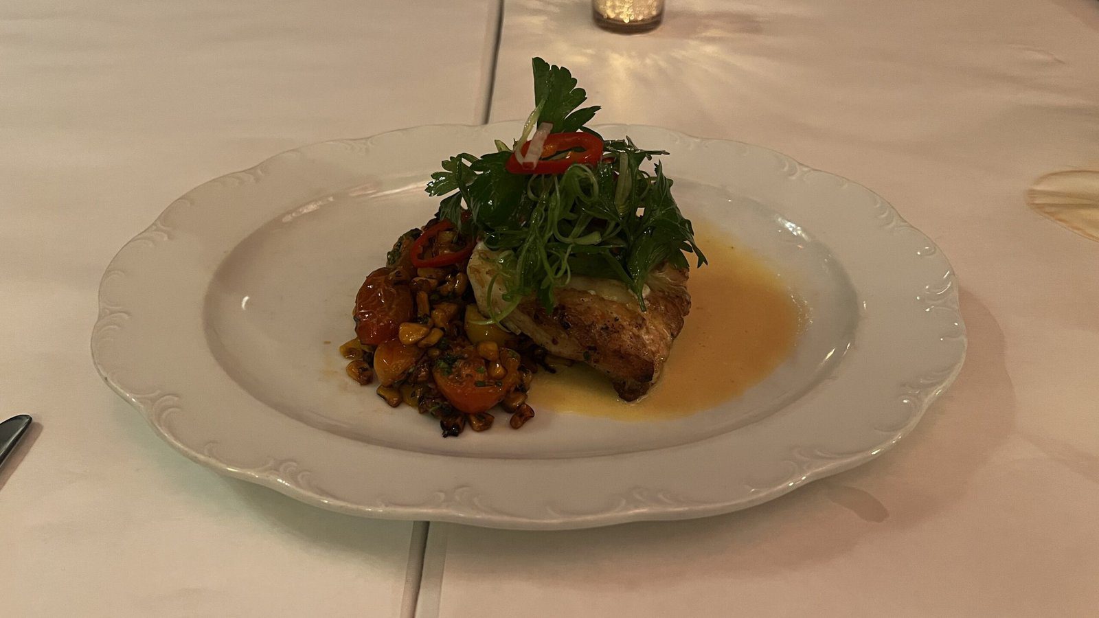 Blue lump crab dish paired with roasted vegetables, fresh herbs, and citrus sauce at Annabelle Brasserie.